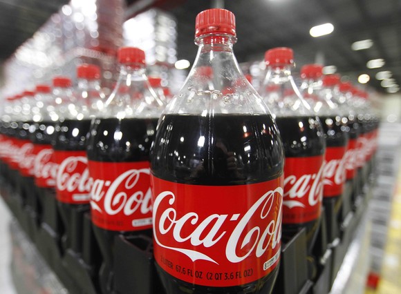 File photo of bottles of Coca-Cola are seen in a warehouse at the Swire Coca-Cola facility in Draper
