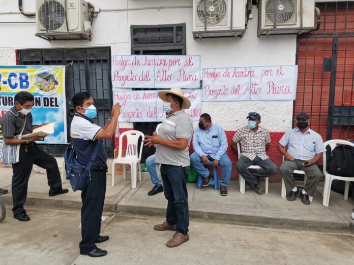 agricultores-696x522